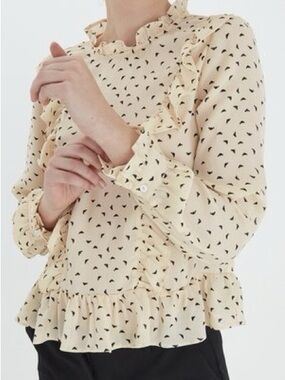 Ruffle-Neck Cream Blouse with Black Heart Print
